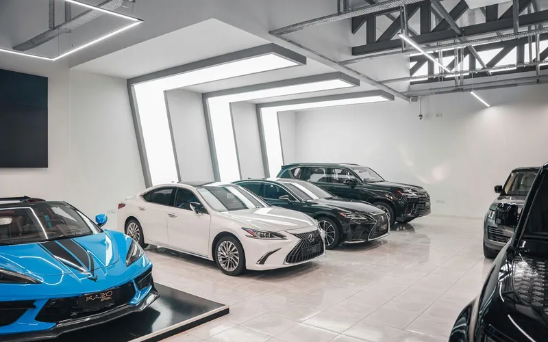 Luxury car showroom with reflective floors and spotless glass walls