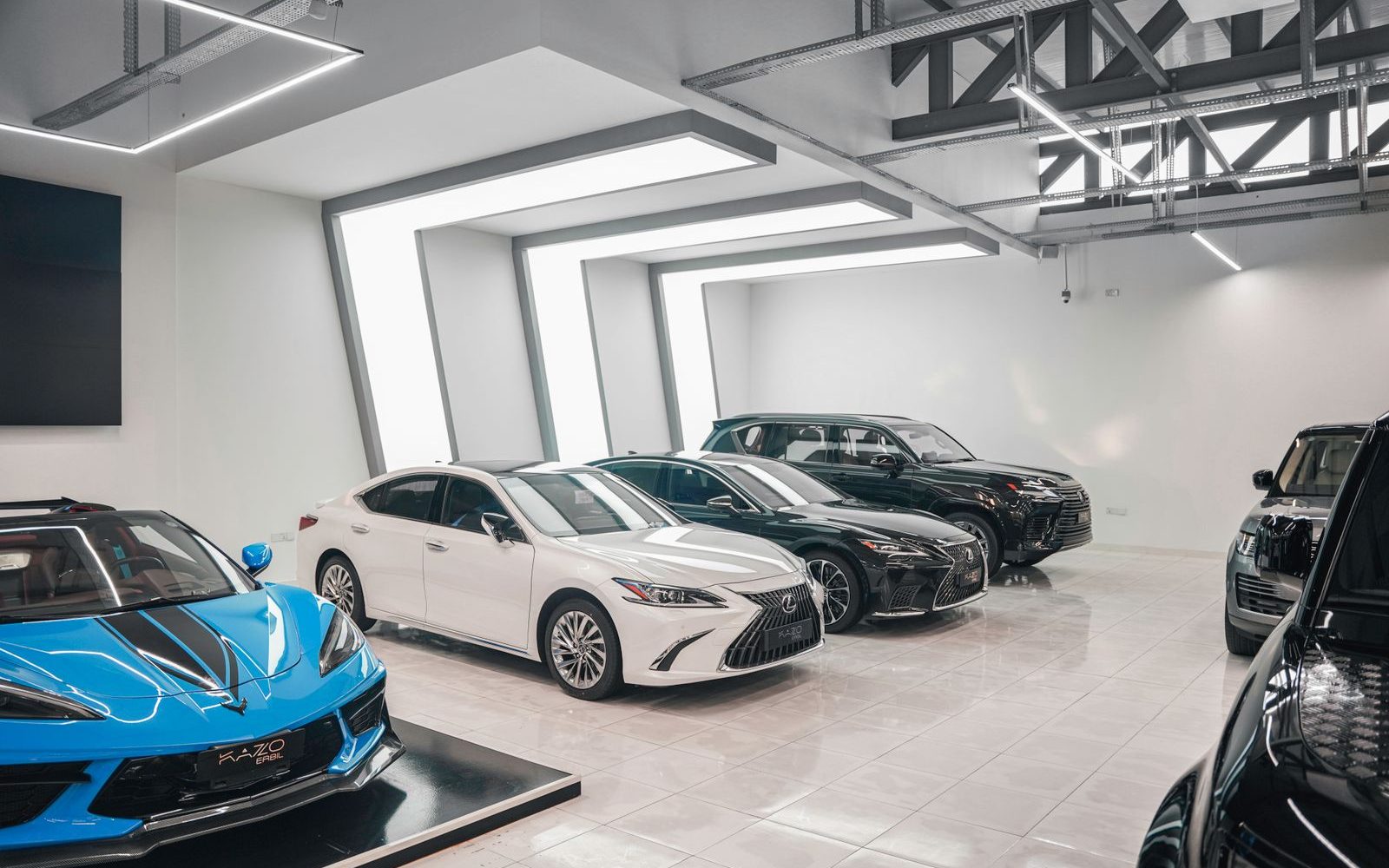 Luxury car showroom with reflective floors and spotless glass walls