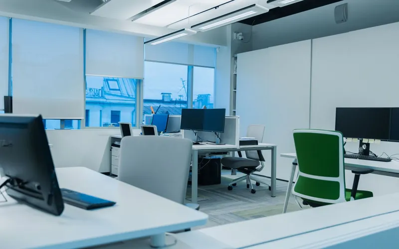 Office at the end of the business day, desks clear and ready for the overnight cleaning visit