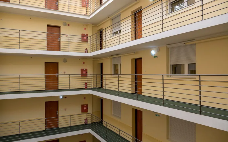 Multi-story apartment building atrium with clean shared walkways