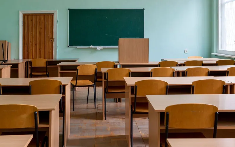 Clean, organized classroom with desks reset for the next school day